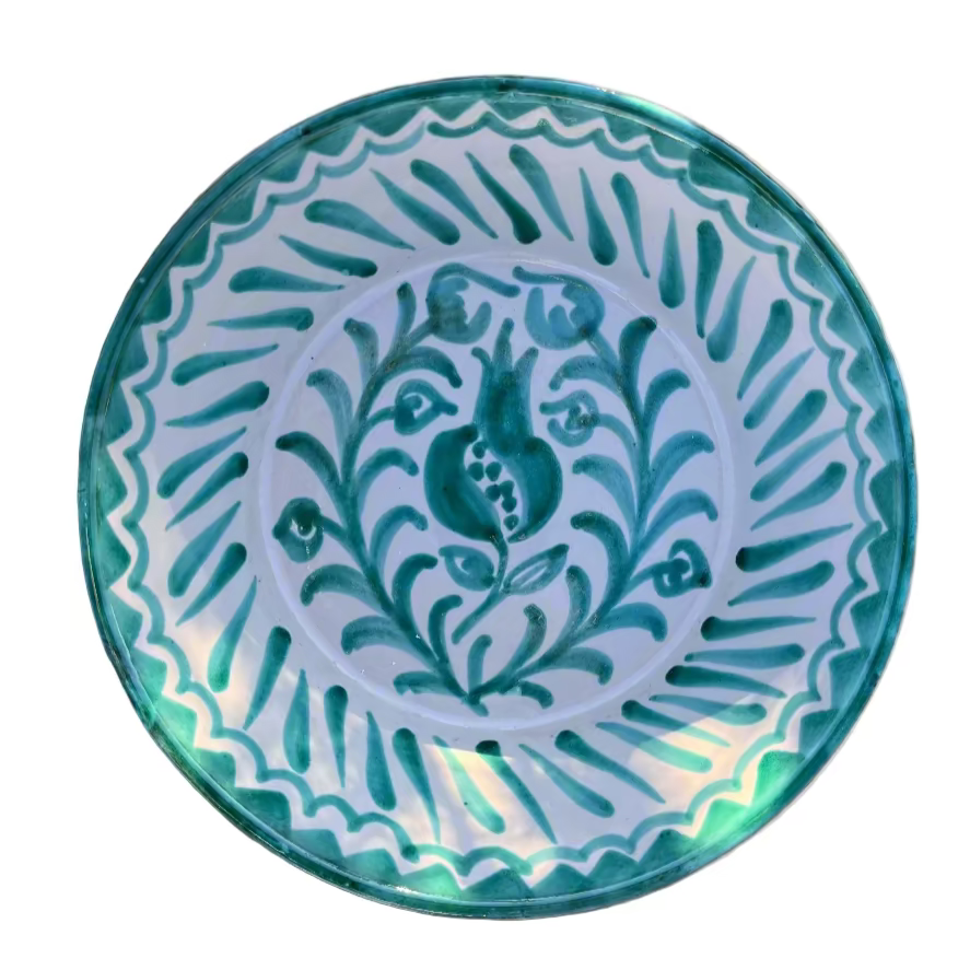 Decorative ceramic plate with blue floral design on a white background